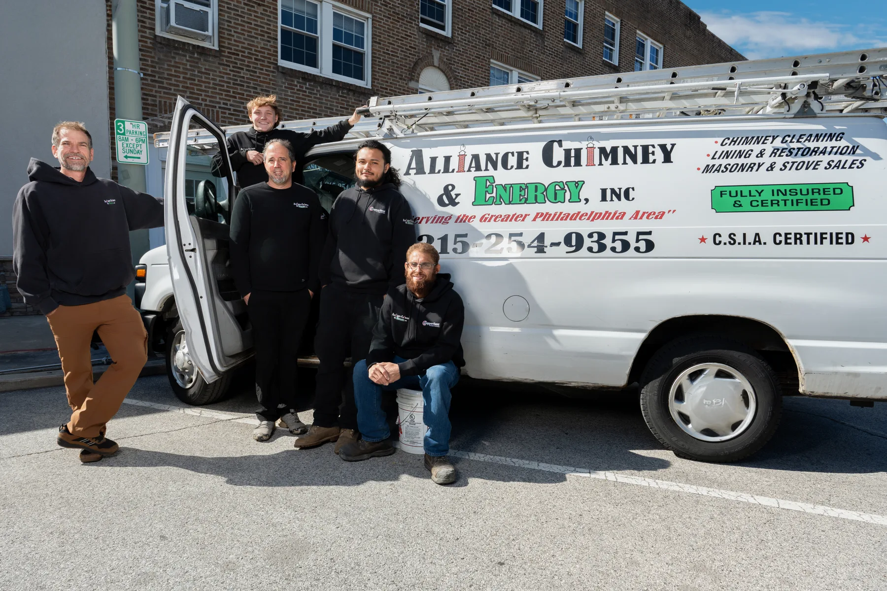 The Alliance Chimney & Energy crew standing by their work van